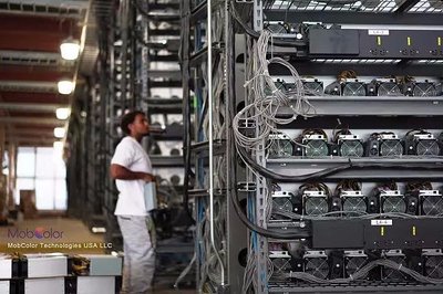Aerial view of a large-scale cryptocurrency mining farm powered by solar panels